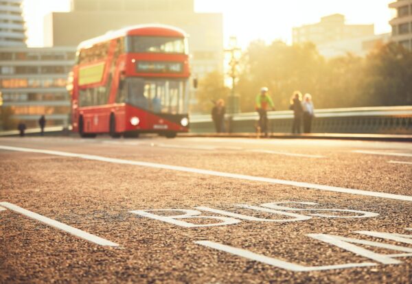 Daily life in the city. Bus lane and bus of the public transport on the street. London, The United Kingdom of Great Britain and Northern Ireland